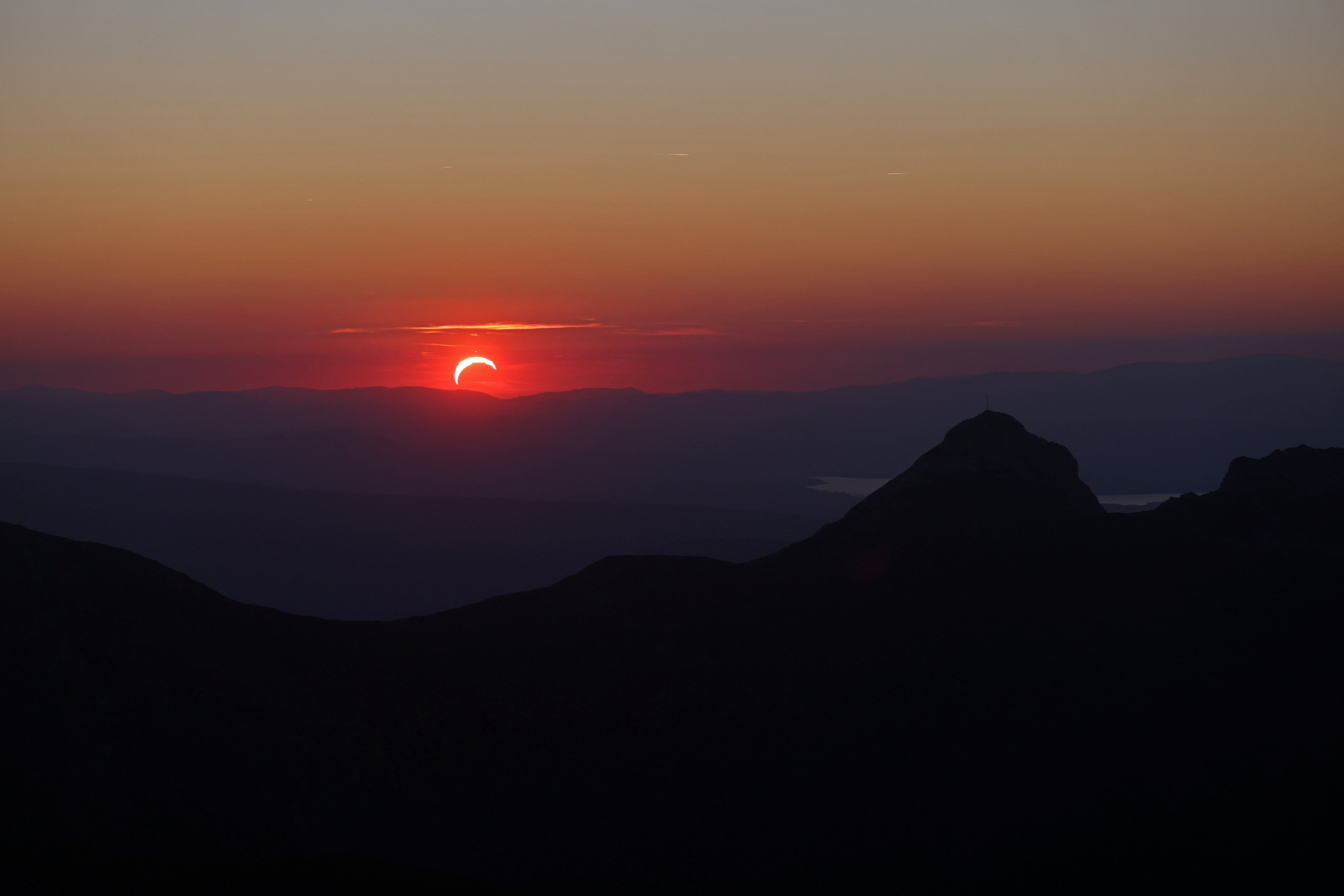 The sunset from Kasprowy Wierch mountain during partial solar eclipse in Tatra National Park near Zakopane, Poland, August 12, 2026