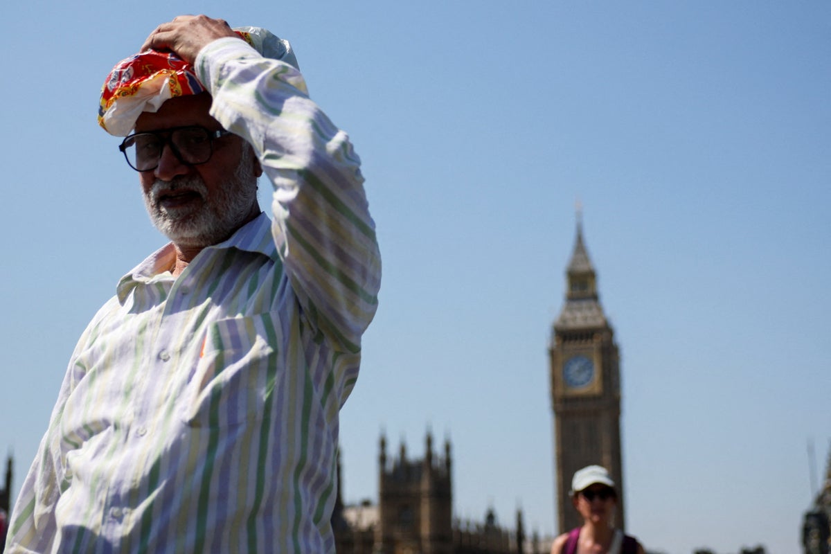 Temperatures hit 38.1C as UK hottest day of the year record broken – weather latest