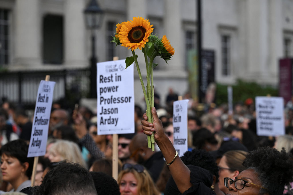 People attend a vigil to remember former Cambridge professor Jason Arday, who died aged 41 on Friday after resigning amid ...
