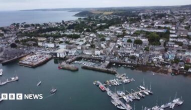 An aerial view of the docks and Falmouth showing parts of the harbour, the docks, boats and buildings.