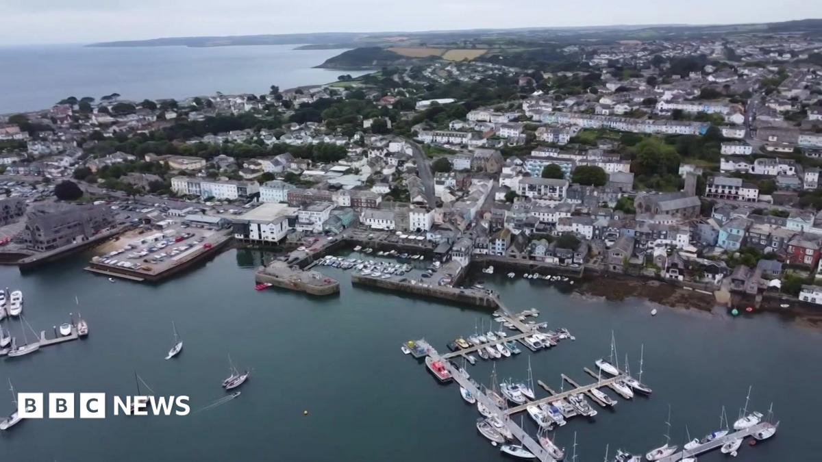 An aerial view of the docks and Falmouth showing parts of the harbour, the docks, boats and buildings.