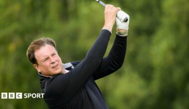 Amateur golfer Allan Harrison watches his ball after hitting a shot