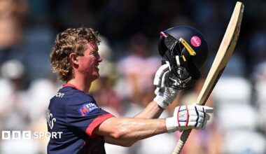 Keaton Jennings smiles as he raises his bat and helmet to celebrate his century for Lancashire against Somerset at Taunton on Tuesday, 11 August, 2026