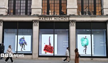 People walking past a luxury department store in Knightsbidge, London