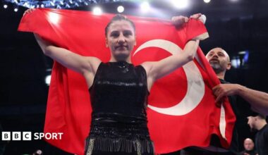 Elif Nur Turhan posing with the Turkish flag