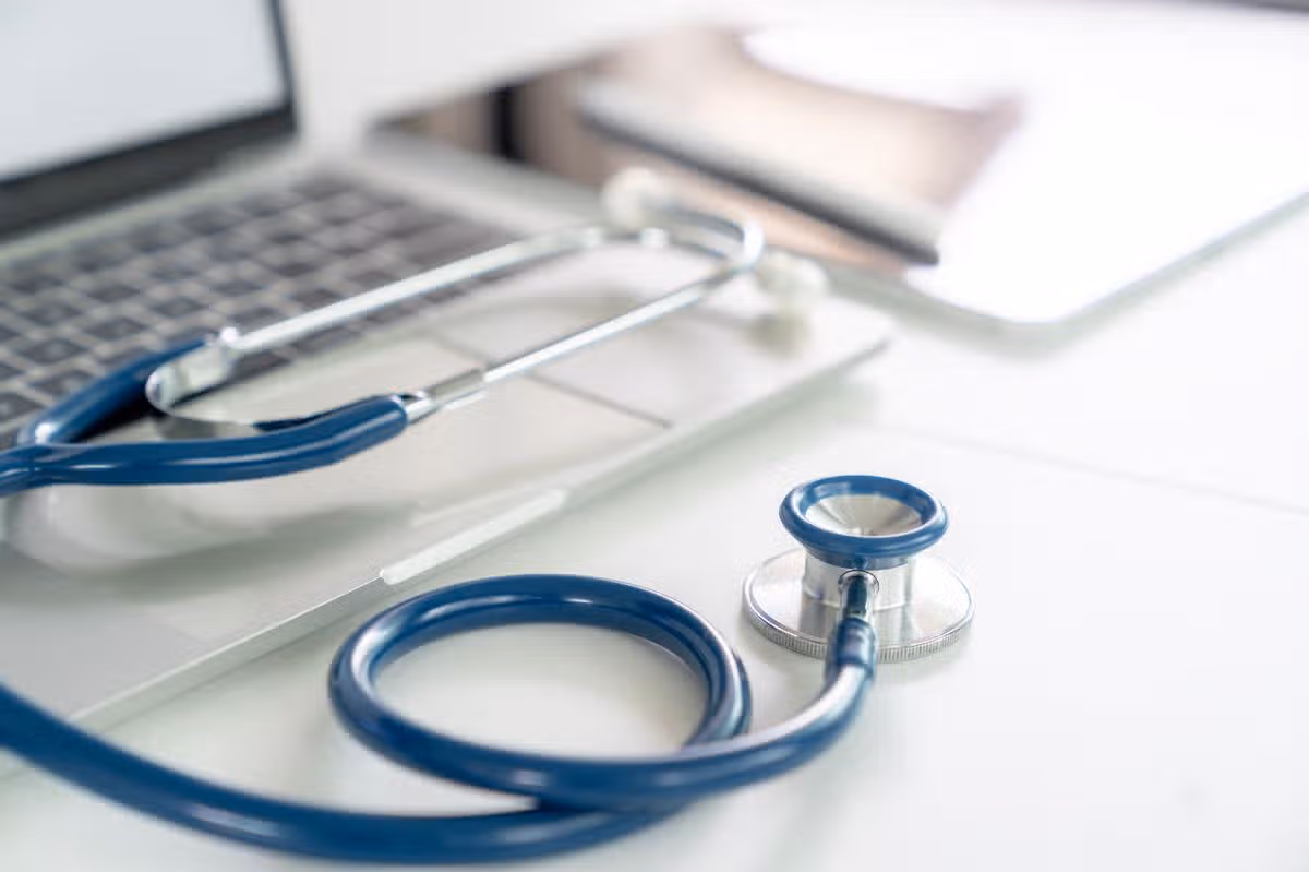 A stethoscope placed on a doctor's desk
