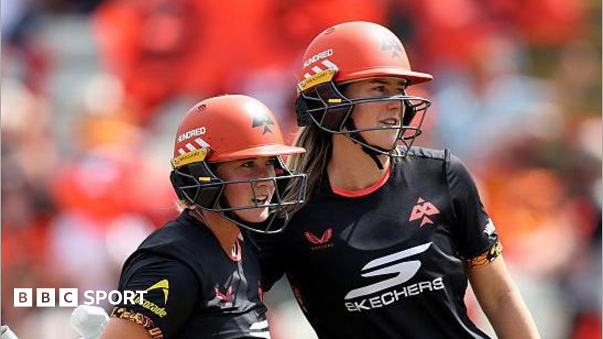 Alice Capsey (left) and Ellyse Perry, both wearing black tops and orange helmets