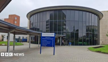 Image shows the glass-fronted entrance to Blackpool Victoria Hospital.