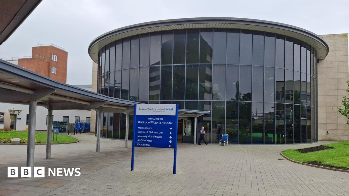 Image shows the glass-fronted entrance to Blackpool Victoria Hospital.