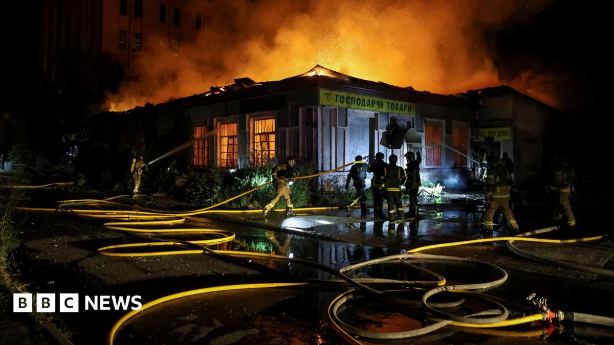 Firefighters work at a site hit by a Russian missile strike, amid Russia's attack on Ukraine, in Kyiv on 20 August.
