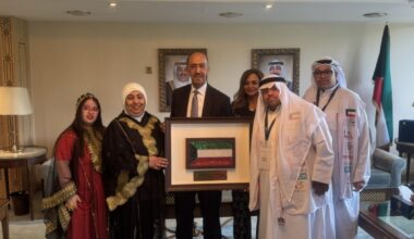 Kuwait's Ambassador to the United Kingdom, Bader Al-Munaikh takes a group photo with the students. - KUNA photos