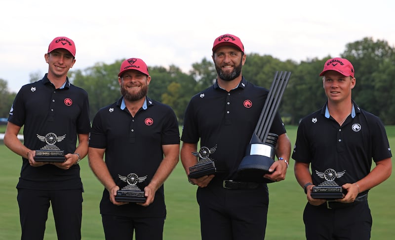 Tom McKibbin, Tyrrell Hatton, Jon Rahm and Caleb Surratt of Legion XIII pose with the LIV Golf Team Championship trophy. Photograph: Justin Casterline/Getty