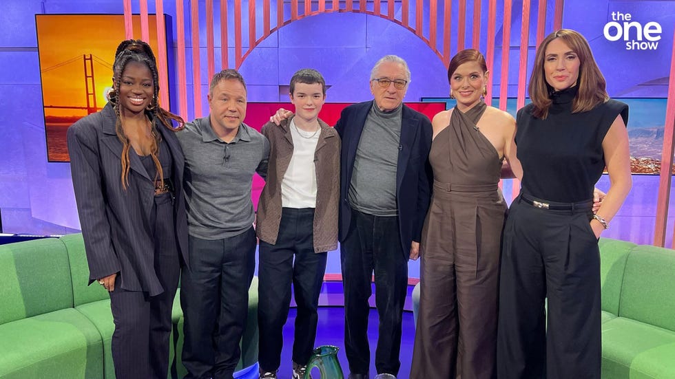 Clara Amfo, Robert De Niro, Debra Messing, Stephen Graham and Owen Cooper, Alex Jones, The One Show group of six people posing on a colorful tv set.