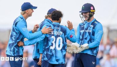 Yorkshire players, in blue shirts, celebrate with spinner Kuldeep Yadav after the dismissal of Ben Stokes