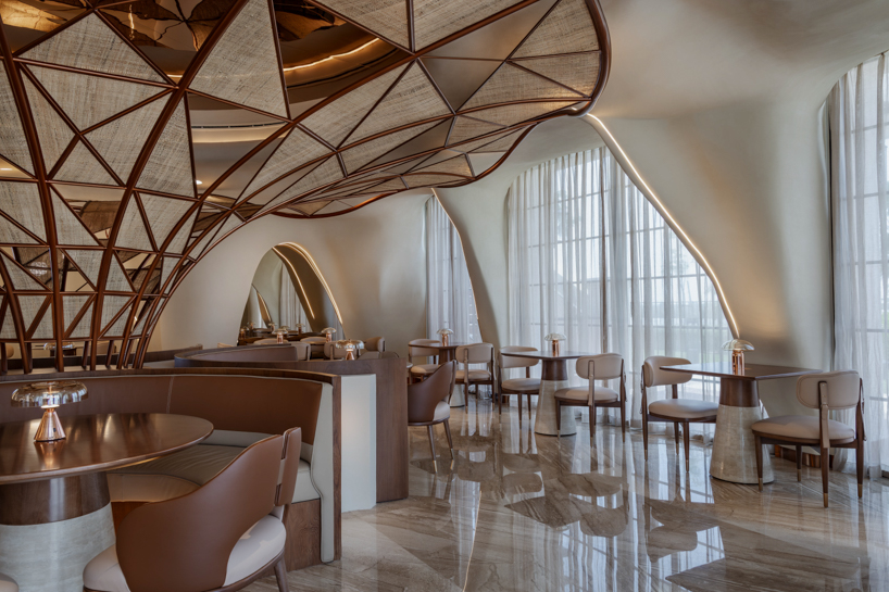 falwa restaurant transforms arabian equestrian heritage into fluid architectural interior - 4