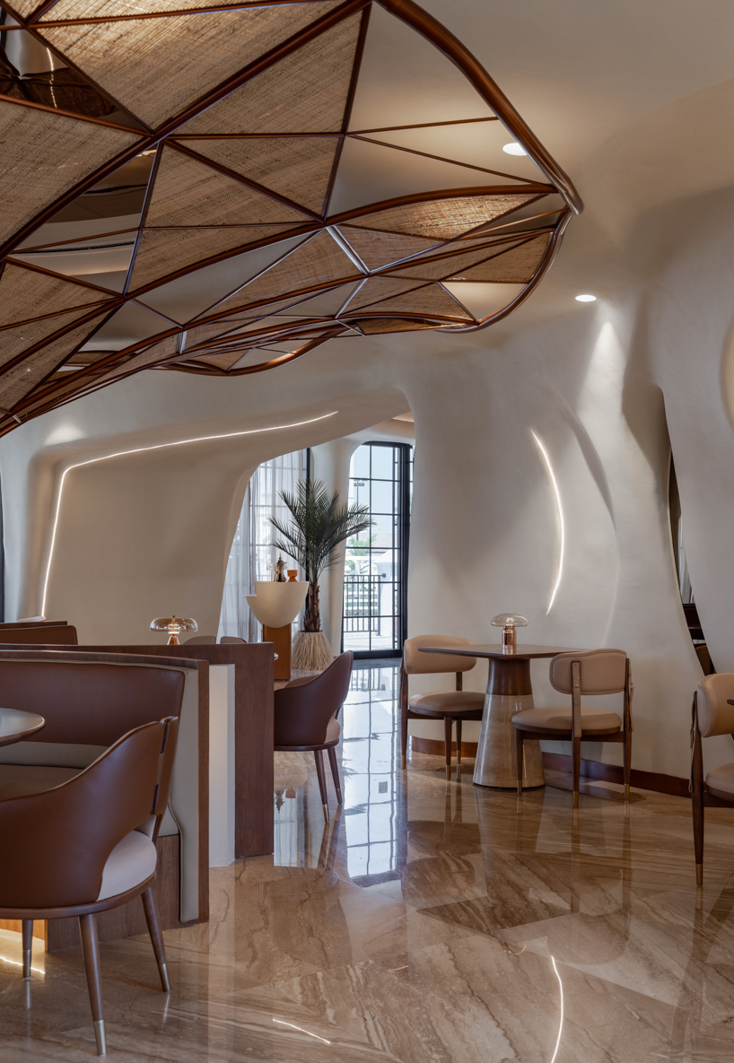 falwa restaurant transforms arabian equestrian heritage into fluid architectural interior - 6