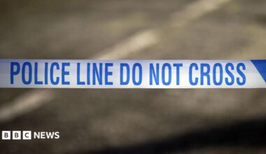 Police tape reading 'Police line do not cross'
