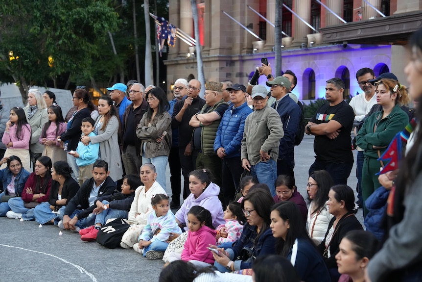 Hundreds gather for candle-light vigil in Brisbane