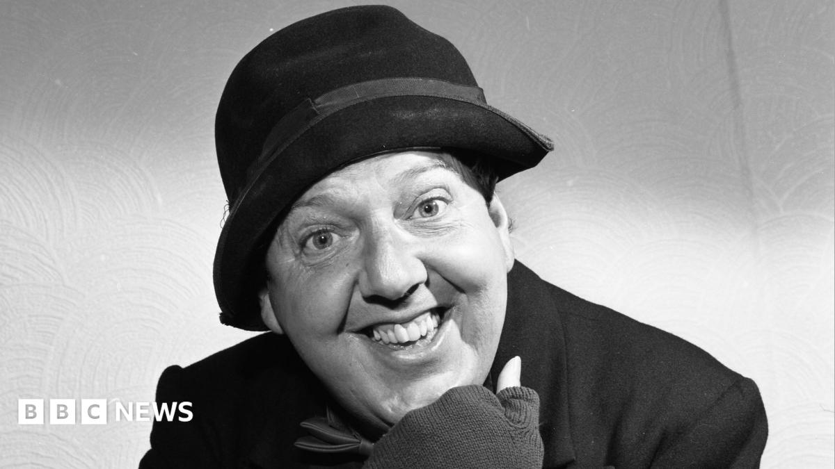 a black and white photograph of Jimmy Cricket