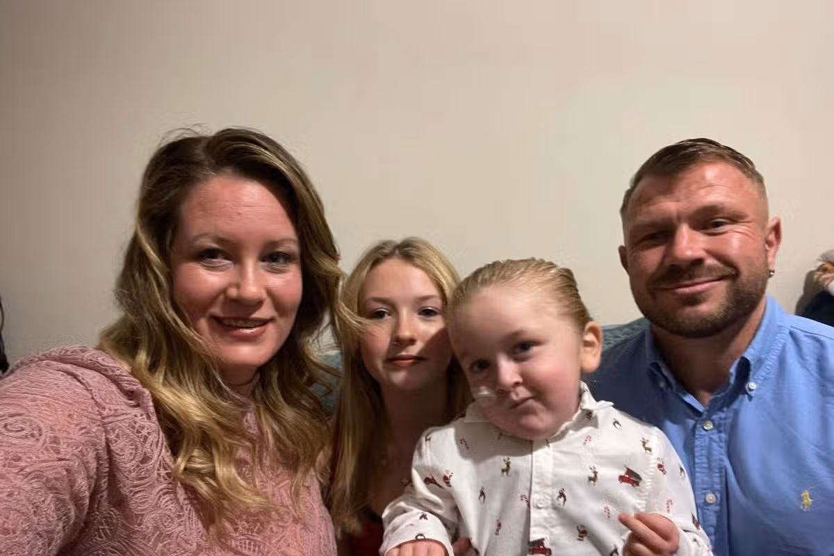 Heather Chilcott and Kieran Done with son Luca, four and daughter Isabelle, 14 at home in Bridgend