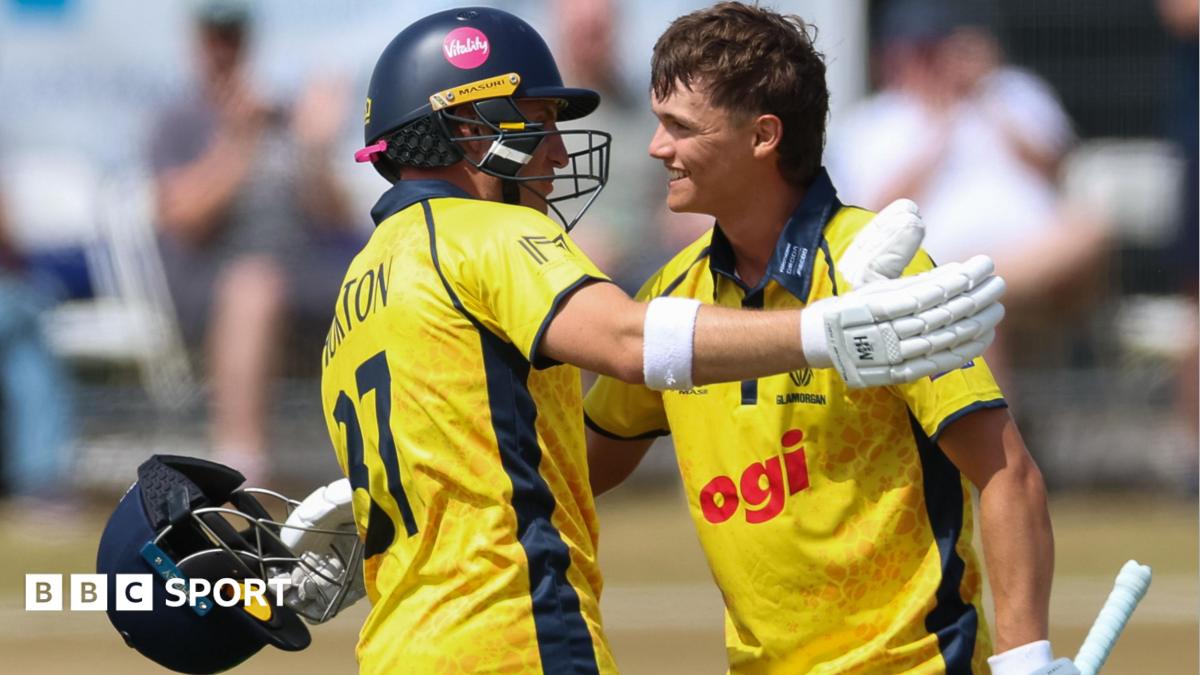 Jack Hope-Bell of Glamorgan, right, celebrates with Alex Horton of Glamorgan, as he reaches his maiden 100 runs