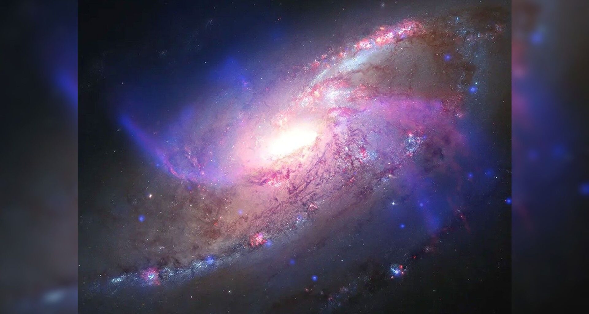 Glowing galaxy with anomalous extra arms photo of the day for Aug. 27, 2026