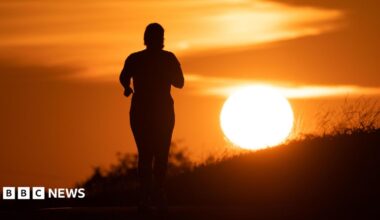 A woman jogs along a path as the sun rises in Frankfurt am Main, Germany, 09 July 2026.