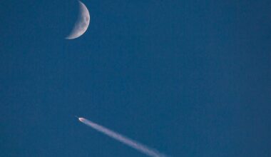 A SpaceX Falcon 9 rocket in the sky with a crescent Moon, 10 July 2024. Credit: George Rose/Getty Images