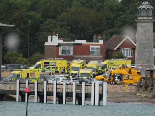 A number of ambulances and a helicopter on scene.