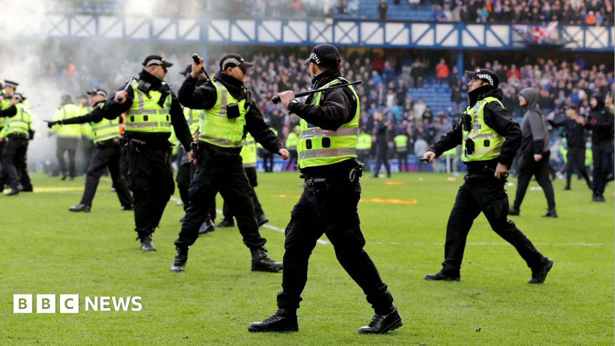 Officers had to keep rival fans apart after the final whistle following Rangers' Scottish Cup match against Celtic at Ibrox in March
