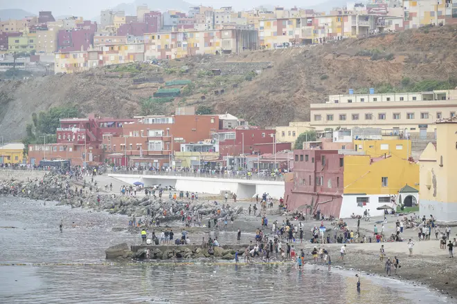 Hundreds of migrants attempt to swim from Morocco to the Spanish city of Ceuta in North Africa