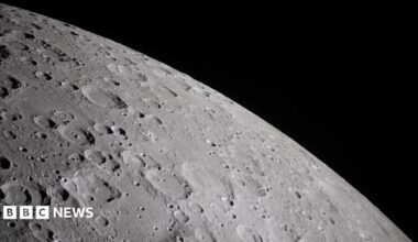 A cratered section of the moon is seen close-up