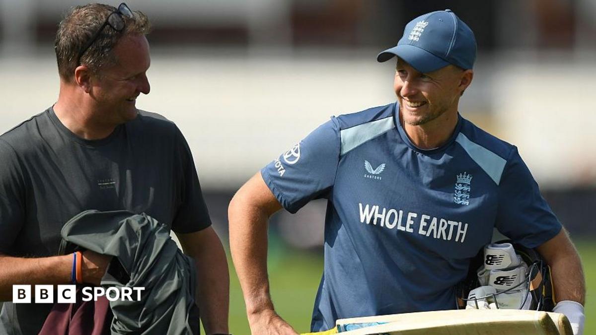 England Test captain Joe Root holding a bat and talking to Rob Key