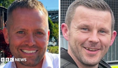Pictures of the two officers. Both are smiling. PC Blades, left, has stubble and short fair hair. PC Clough also has stubble and short dark hair.