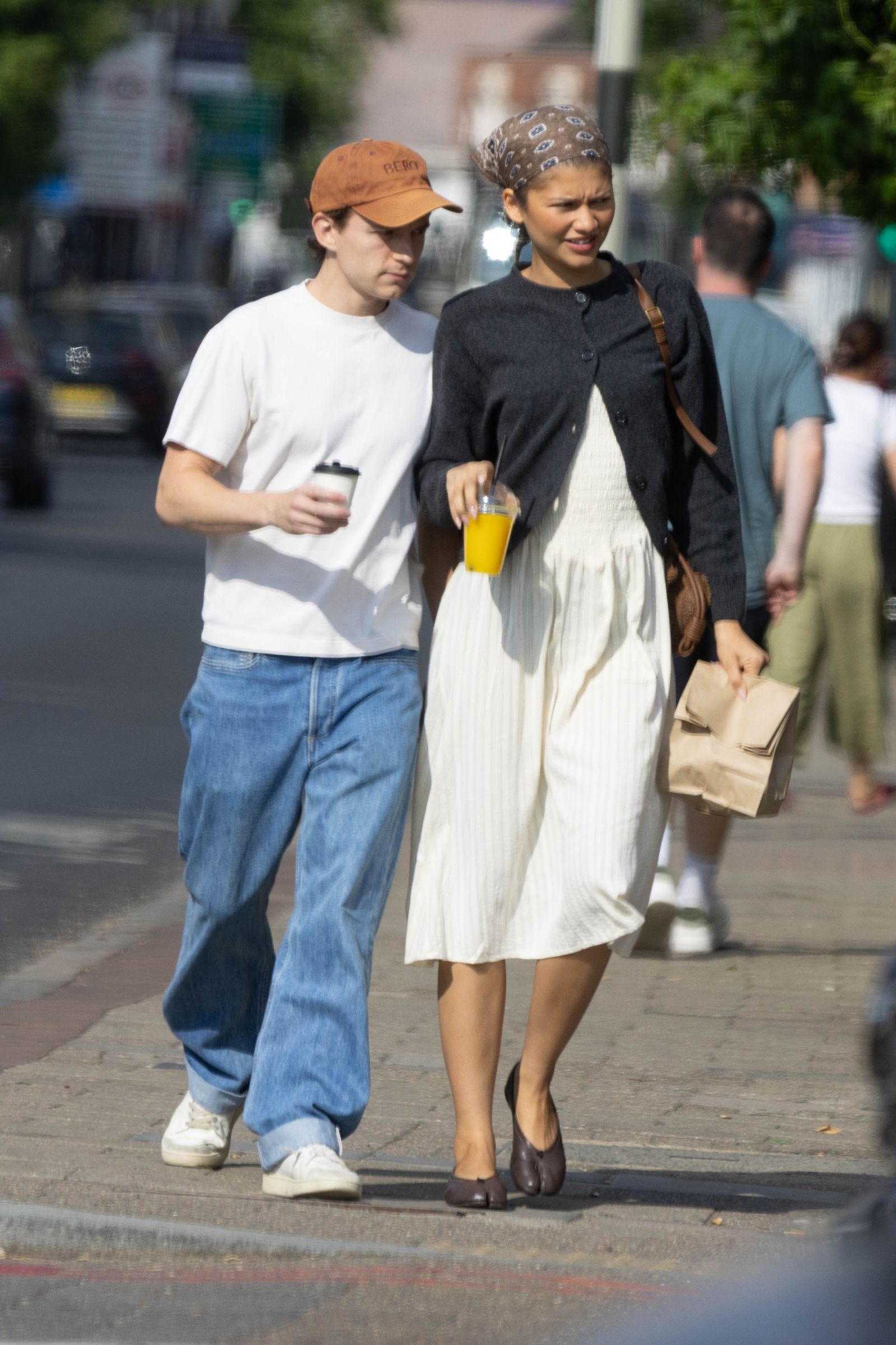 EXCLUSIVE Zendaya Rocks A Head Scarf As She Steps Out For A Coffee Run With Tom Holland In London.The pair who married...