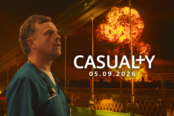 Dylan looks upwards a fireball engulfing the skies of Holby City in key art from Casualty