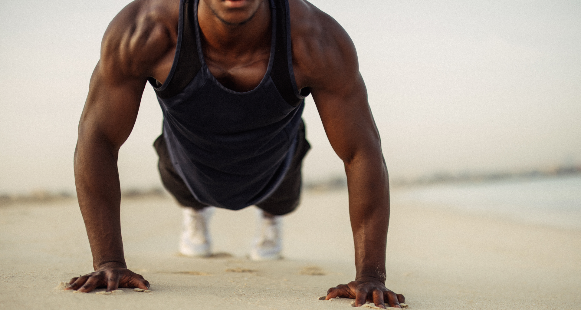 A man performing a push up outdoors