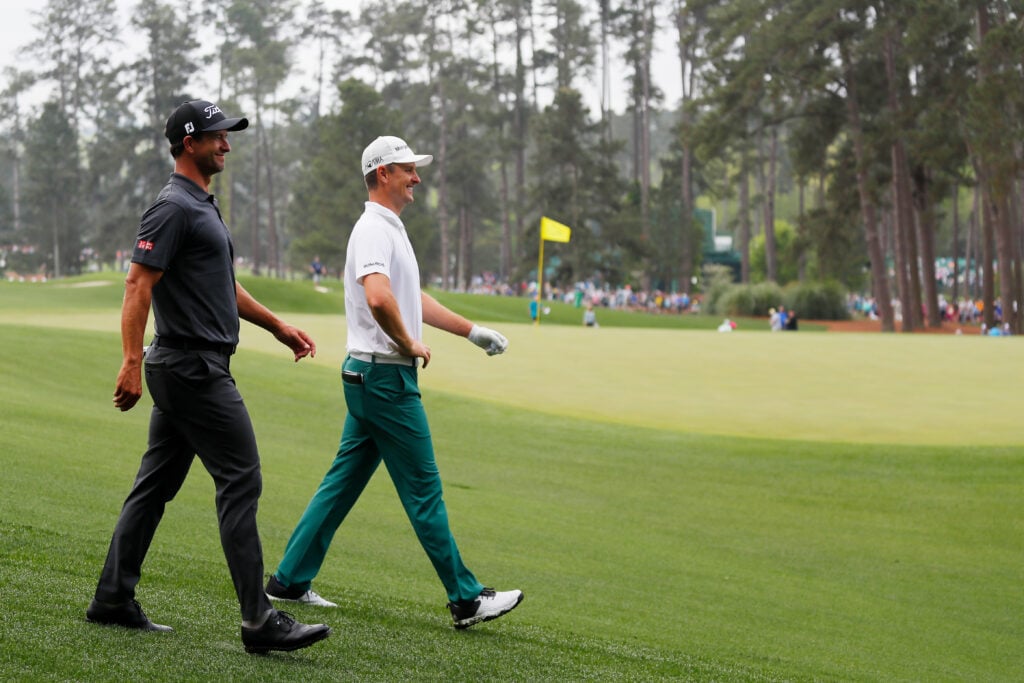 Adam Scott and Justin Rose during a practice round prior to The Masters at Augusta National