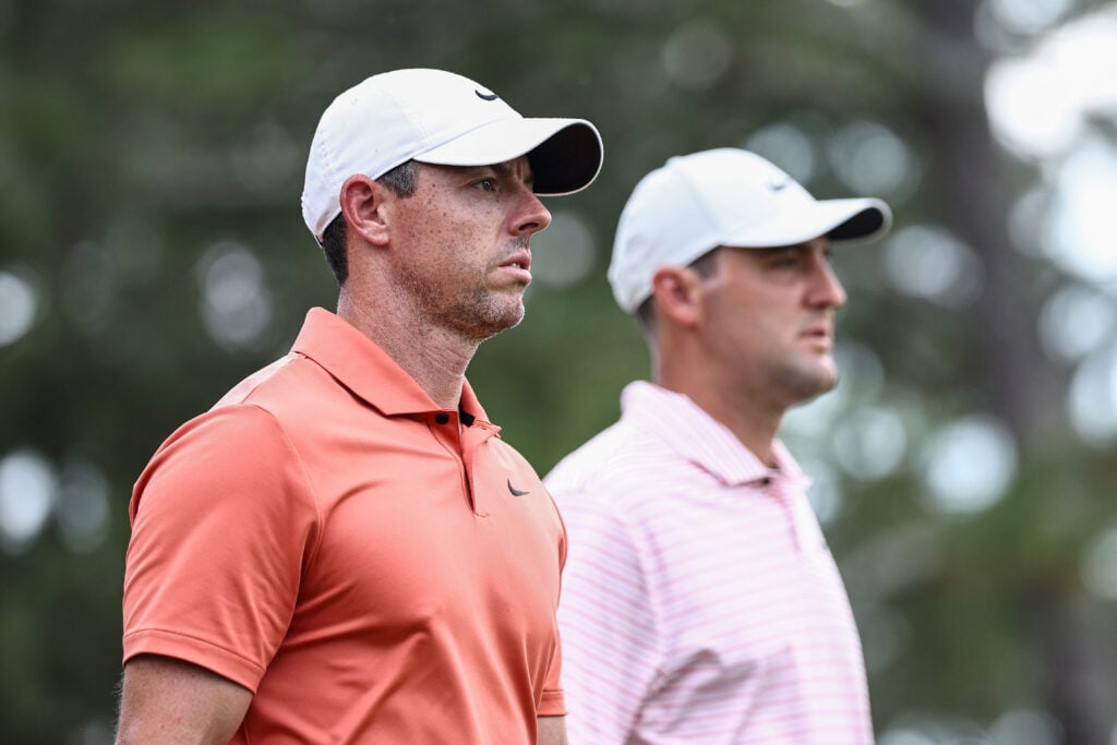 Rory McIlroy of Northern Ireland and Scottie Scheffler of the United States walk off the ninth tee during the first round of the 124th U.S. Open at Pinehurst Resort
