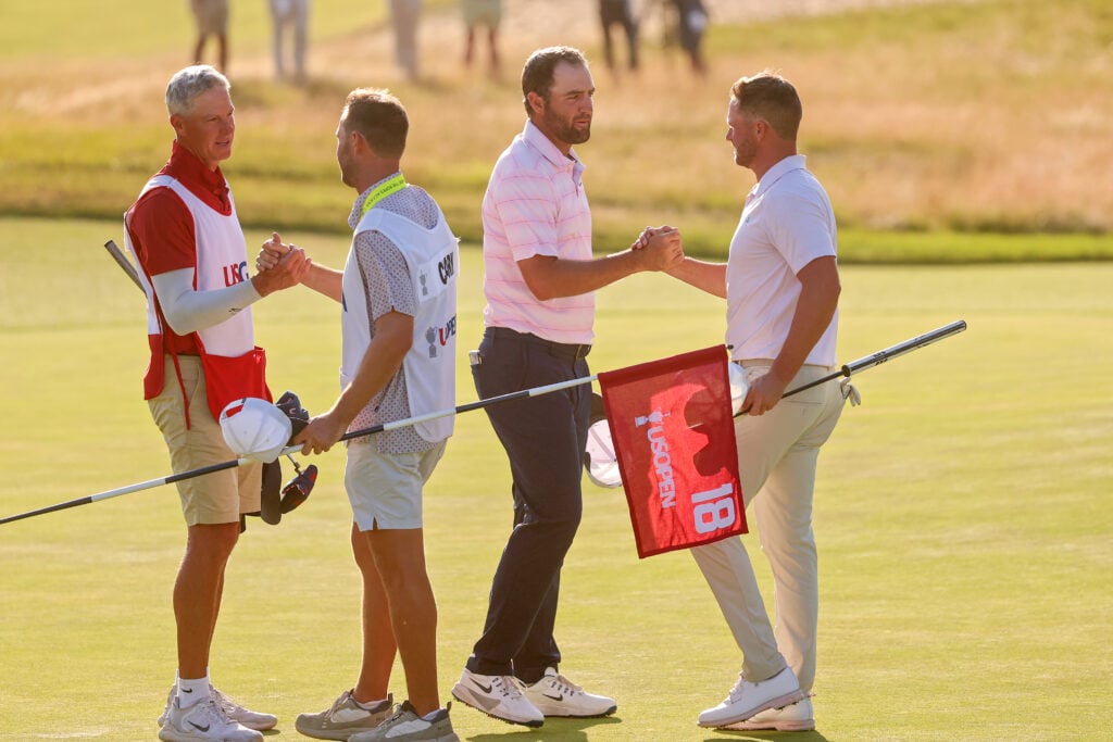 Wyndham Clark and Scottie Scheffler shake hands after the final round of the US Open