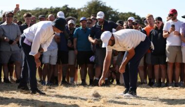 SOUTHPORT, ENGLAND - JULY 19: Scottie Scheffler of the United States speaks to rules official on the 17th hole on day four of the The 154th Open Championship at Royal Birkdale on July 19, 2026 in Southport, England. (Photo by Richard Heathcote/Getty Images)