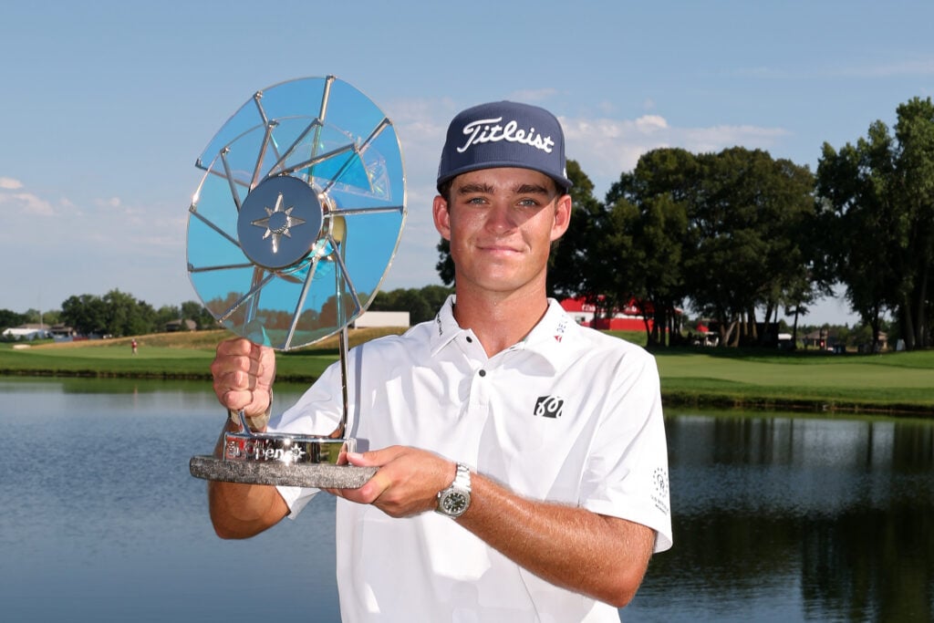 Jackson Koivun of the United States poses with the Elemental Swing trophy after winning the 3M Open 2026