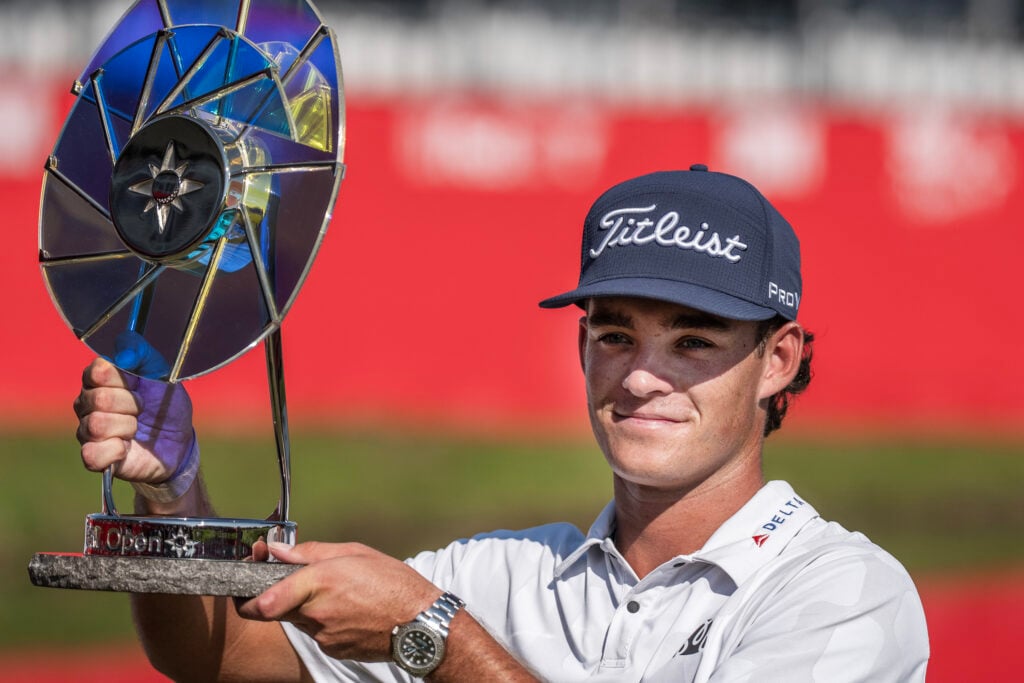 Jackson Koivun hoists the trophy after winning the 3M Open at the Tournament Players Club Twin Cities