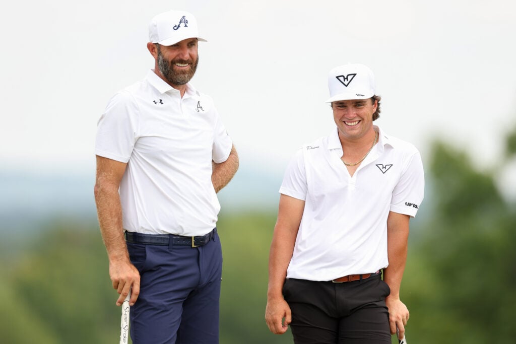 Michael La Sasso with Dustin Johnson on the 14th green during day three of LIV Golf New York at Trump National Golf Club