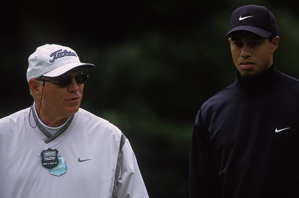 Tiger Woods and Butch Harmon speak during a practice round ahead of The Open Championship in 2001