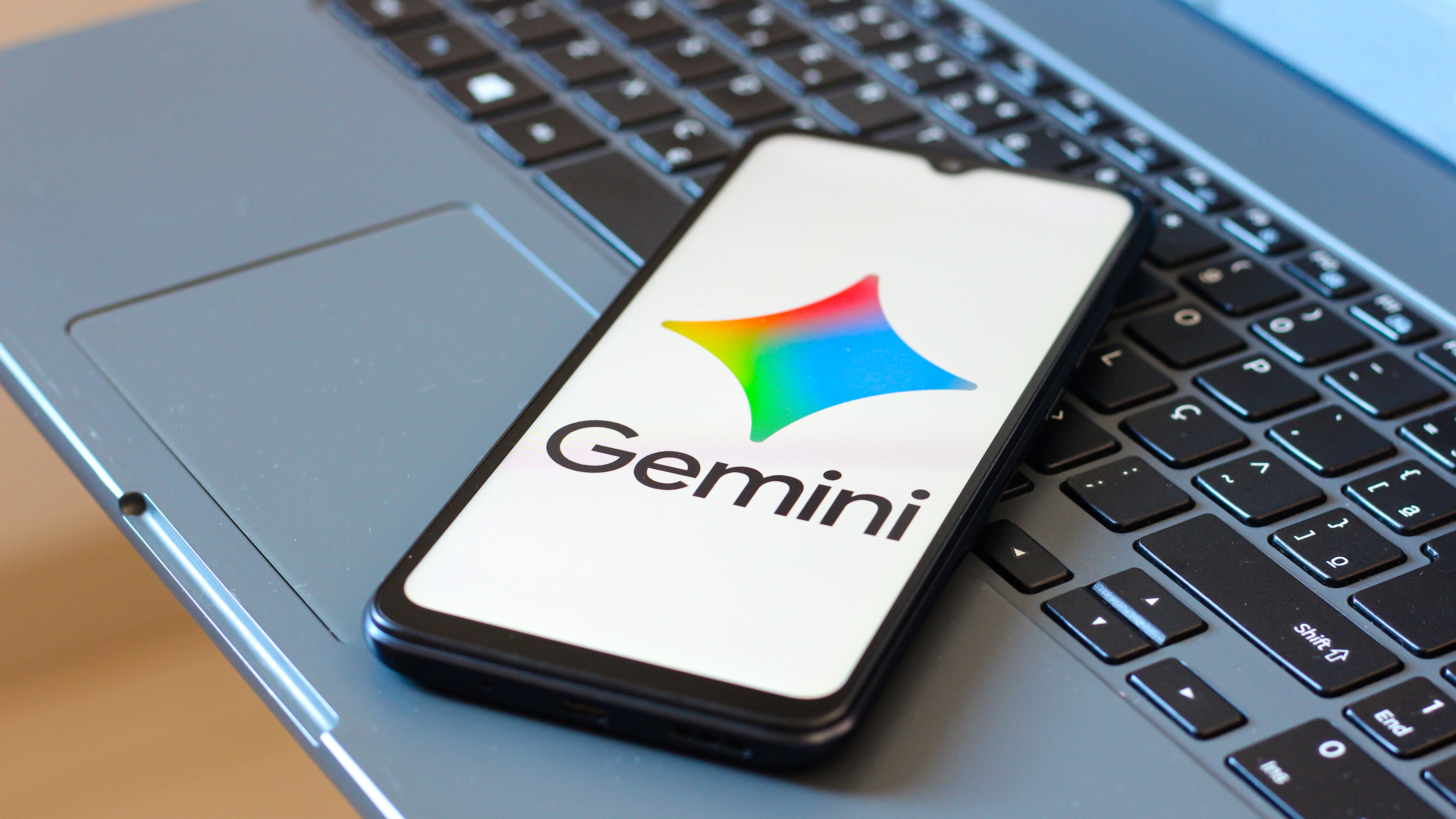 The Google Gemini logo is seen displayed on a smartphone screen.