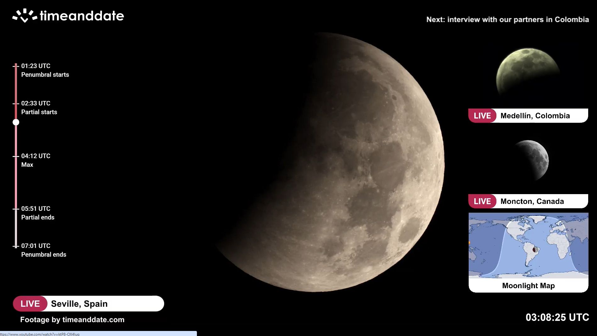 close up view of the moon in the night sky with a darker region to the upper left - the umbra has started moving onto the moon..