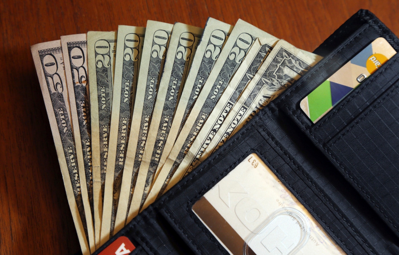 Cash fanned in wallet