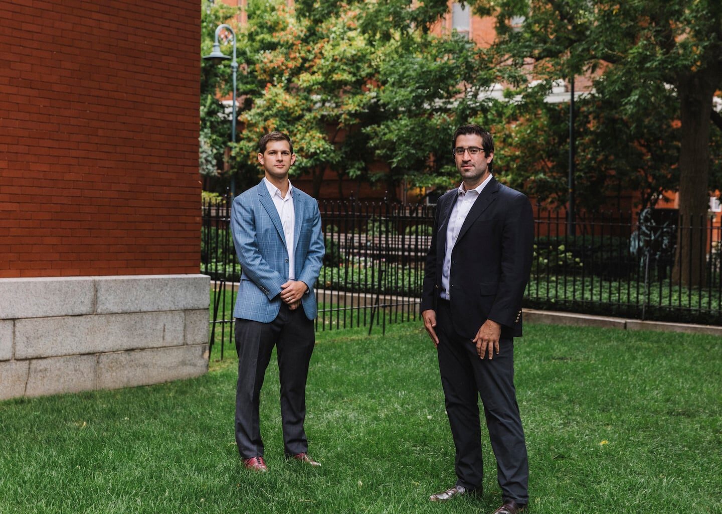 Amylyx co-founders Justin Klee, left, and Joshua Cohen outside of their offices in Cambridge, Mass., in 2020.