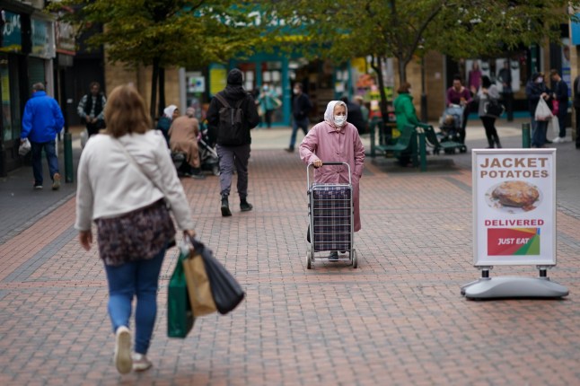 MIDDLESBROUGH, ENGLAND - OCTOBER 02: Shoppers walk through the centre of Middlesbrough on October 02, 2020 in Middlesbrough, England. The mayor of Middlesbrough, Andy Preston is leading a protest over new coronavirus restrictions. The stance has led to fears that residents will fail to take seriously new measures imposed in the area. The elected mayor of Middlesbrough said he was prepared to defy the Government and reject new Covid-19 measures imposed on the town. This is thought to be the first time an authority leader has defied the government in the UK over coronavirus lockdown rules. Andy Preston is the 54-year-old Mayor of Middlesbrough who was elected to the post on May 2, 2019. He broke away from the Labour Party and became an independent candidate after drawing criticism from the party. New coronavirus restrictions in Liverpool, Warrington, Hartlepool and Middlesbrough will come into force on Saturday October 3 at one minute past midnight. It follows the news that households in parts of the North East of England are to be??legally banned from meeting each other indoors in any setting. Existing measures for Northumberland, Newcastle, Tyneside, Gateshead, Sunderland and County Durham were??tightened from September 30 at the request of local authorities because the virus was still spreading. (Photo by Ian Forsyth/Getty Images)